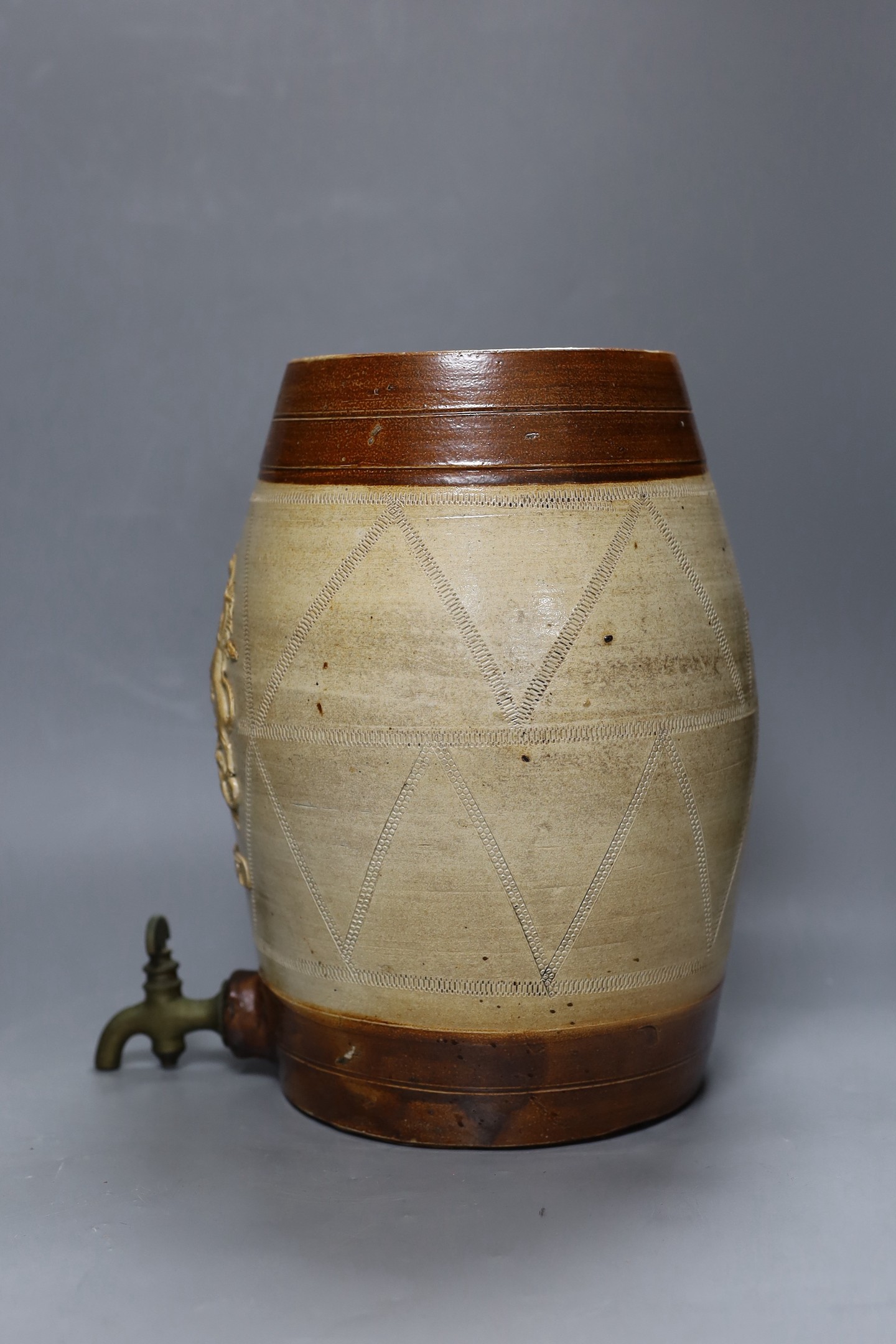 A 19th century salt glazed stoneware Brandy barrel, with Royal coat of arms sprigging, 33cm